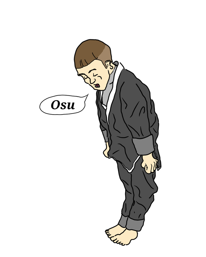 A little guy with tightly cropped brown hair in a dark gray gi with no belt, holding his hands in fists at his sides and slightly bowing as he says Osu